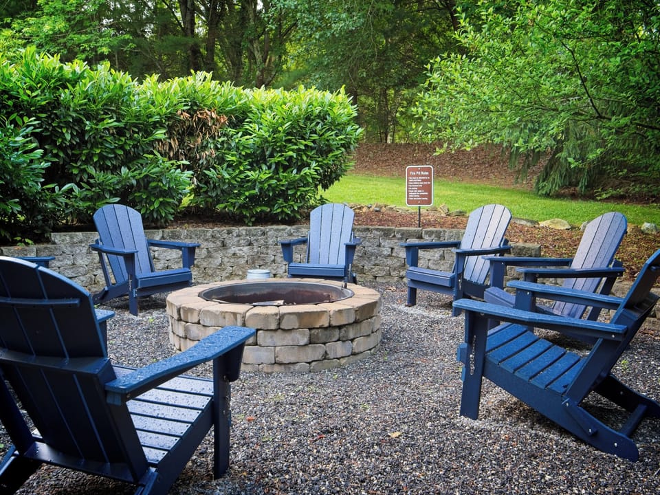 Grab an Adirondack chair, get the fire going, and stay out longer than you planned — firewood included, and the spring blooms make this the spot no one wants to leave first.