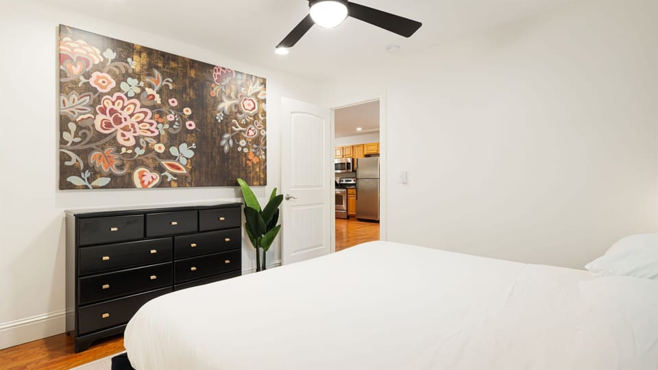 Unpack into a full nine-drawer dresser — your bedroom corner is furnished for real stays, not just overnight bags. 