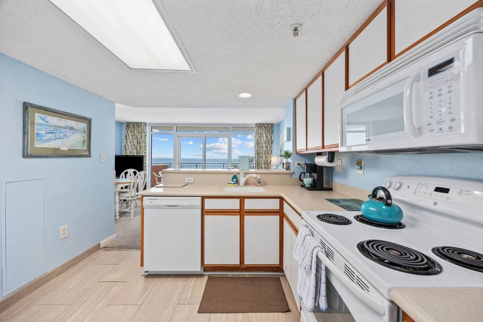 Kitchen with Breakfast Bar overlooking dining/living