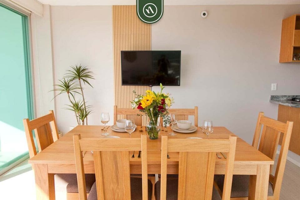 A beautiful wooden table set for your group. Whether it's a morning breakfast or a celebratory dinner, this bright space is the heart of the home.