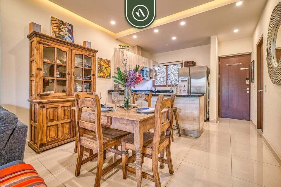 Share meals with family and friends in this inviting, open-plan dining space. It features a beautiful, solid-wood dining table set for four.