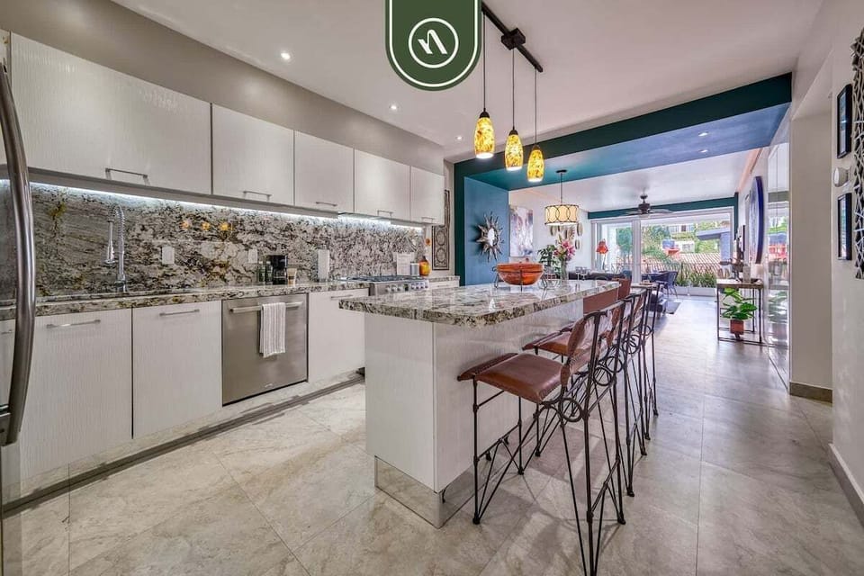 A sleek and fully equipped kitchen designed for both functionality and style, perfect for preparing meals with ease.