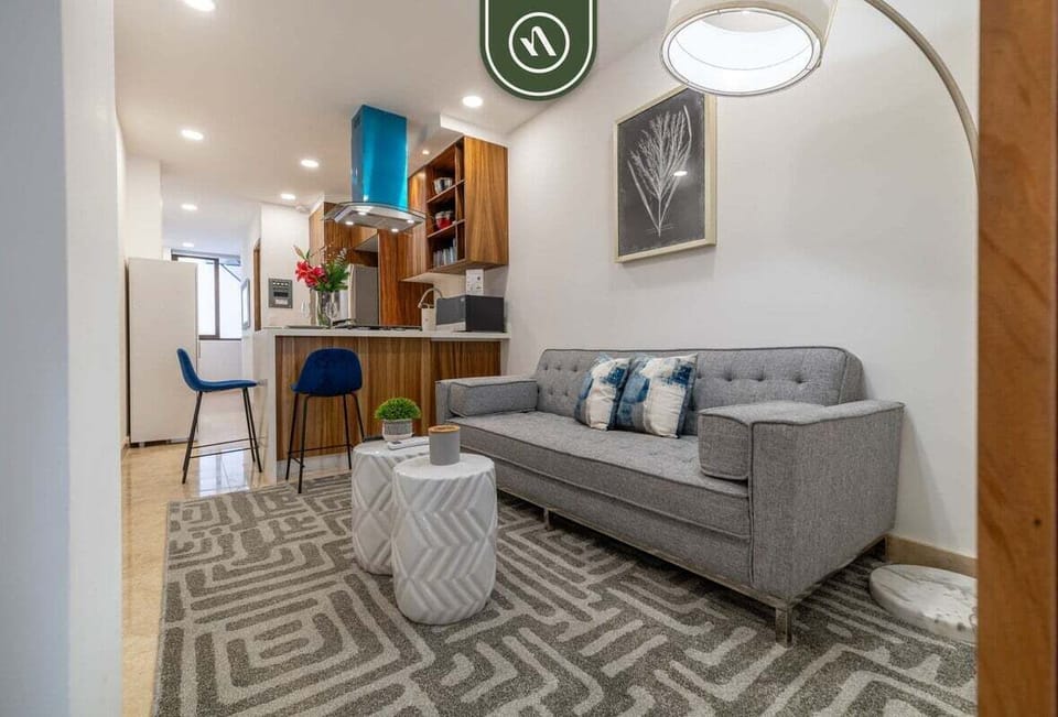 Experience seamless living in this thoughtfully designed space. The cozy lounge area flows directly into the modern kitchen and breakfast bar, creating an inviting environment for relaxing or enjoying a quick meal.