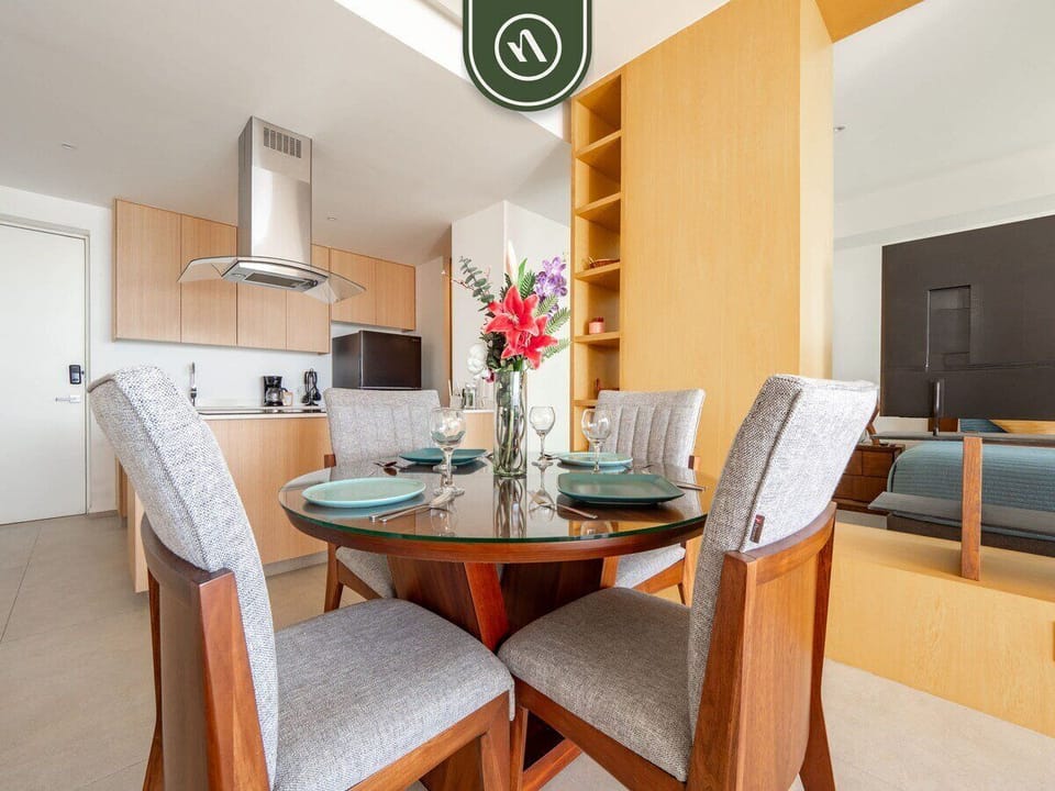 Enjoy meals in style at this circular glass-top table with upholstered seating for four. The open layout ensures you never miss the view while dining.