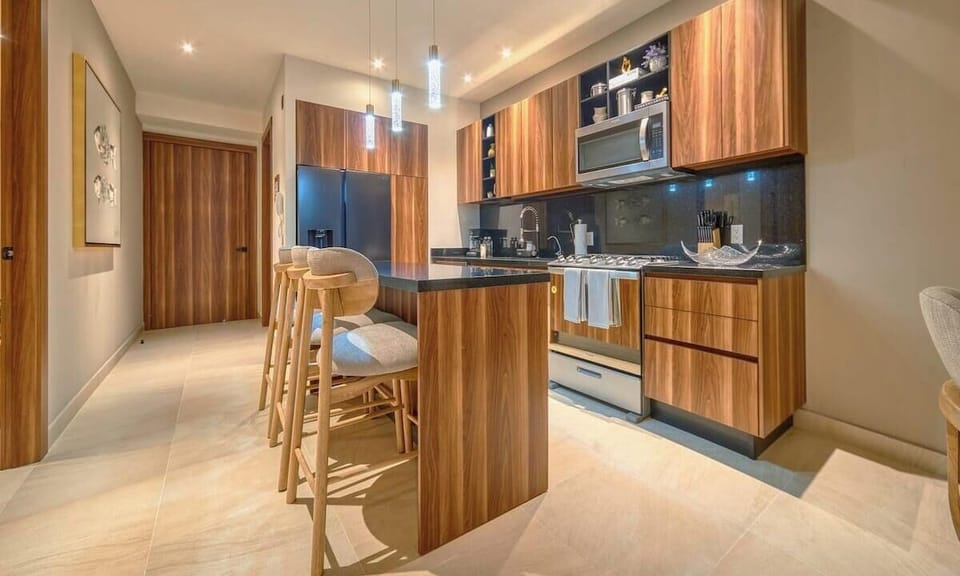 Fully equipped kitchen with granite countertops and premium appliances.