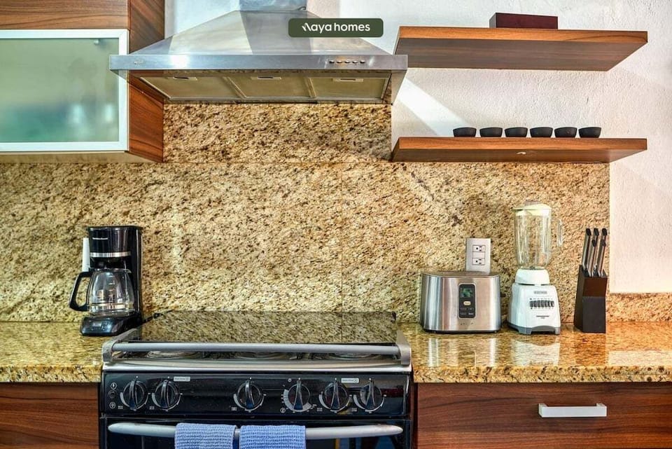 Enjoy a fully equipped kitchen with quality appliances, generous counter space, and everything needed to prepare meals during your stay.