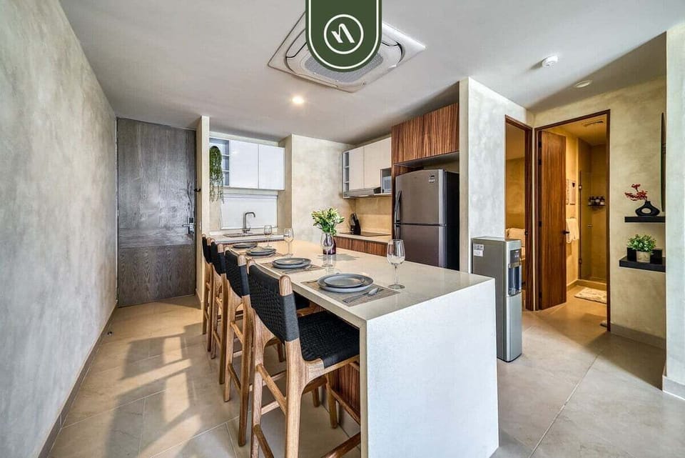 Gather around the spacious kitchen and dining area, fully equipped for preparing meals and enjoying time together.