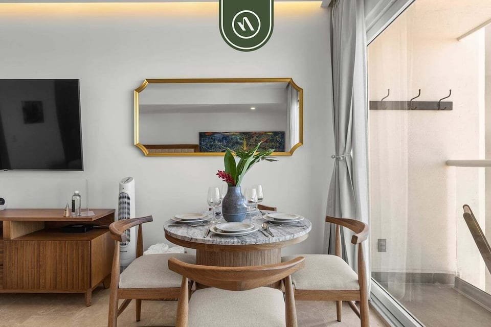 Bright dining area with modern décor and comfortable seating, perfect for enjoying meals, morning coffee, or a relaxed evening indoors.