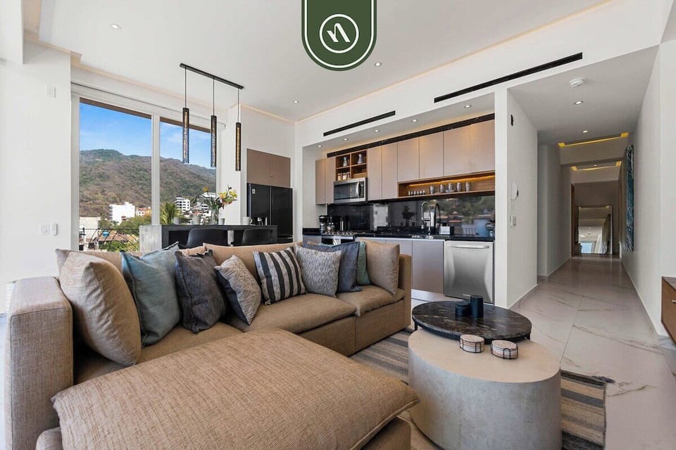 Sophisticated yet welcoming, the living room serves as the heart of the home, combining modern elegance with relaxed coastal living.