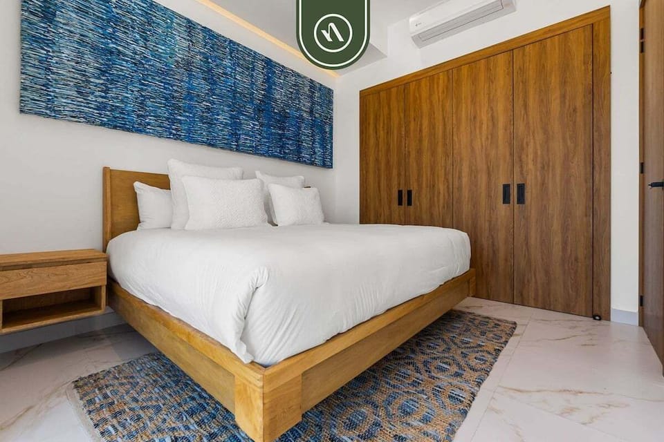 Beautifully designed guest bedroom with modern finishes, ample storage, and a peaceful atmosphere for a comfortable stay.