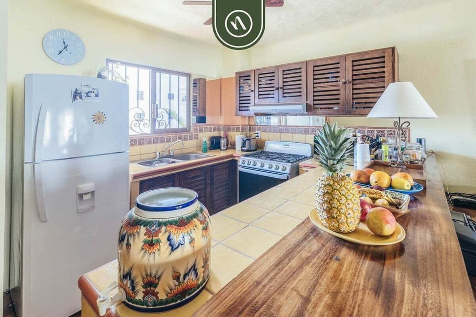 Modern kitchen with stainless steel appliances and ample workspace.