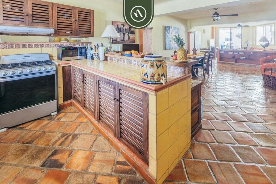 Modern kitchen with stainless steel appliances and ample workspace.