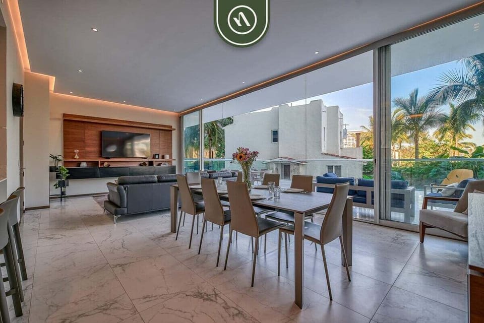 Enjoy seamless indoor-outdoor living with a bright dining area, comfortable lounge seating, and easy access to the private terrace.