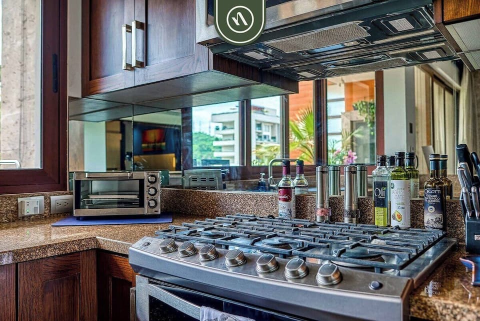 Cook like a chef with our premium six-burner gas range. The kitchen is fully stocked with appliances and ample counter space for your convenience.
