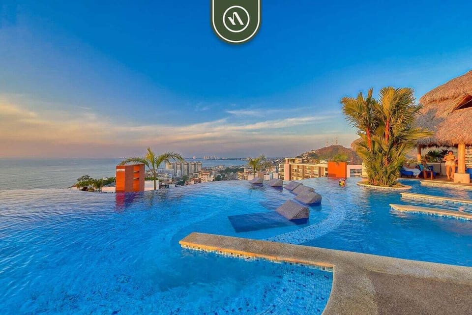 Soak up the tropical sun on our stunning pool deck. Swim in the spectacular infinity pool with sweeping views of the sparkling coastline.