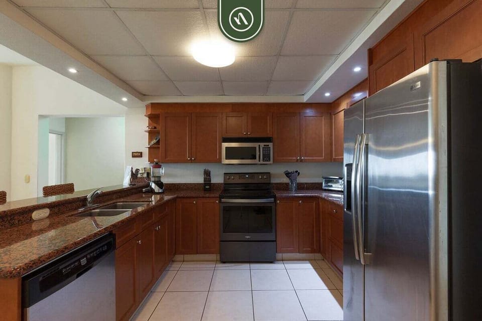 Prepare your favorite meals in the spacious kitchen equipped with full-size appliances, generous counter space, and plenty of storage.