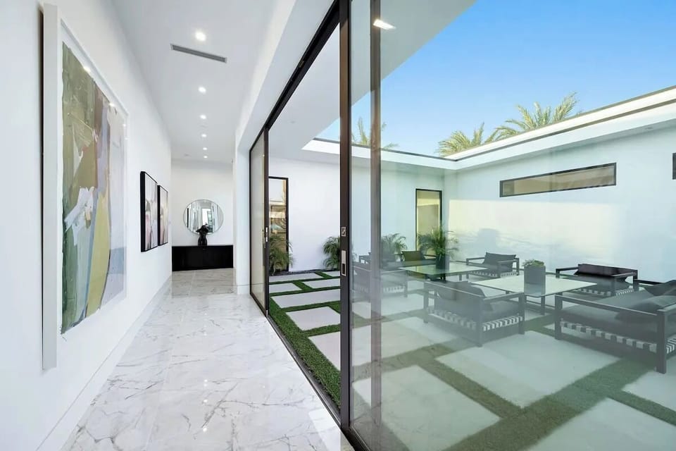 Expansive glass doors invite the outdoors in.