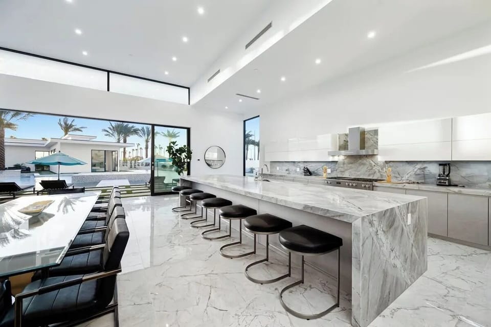 Large island with barstool seating.