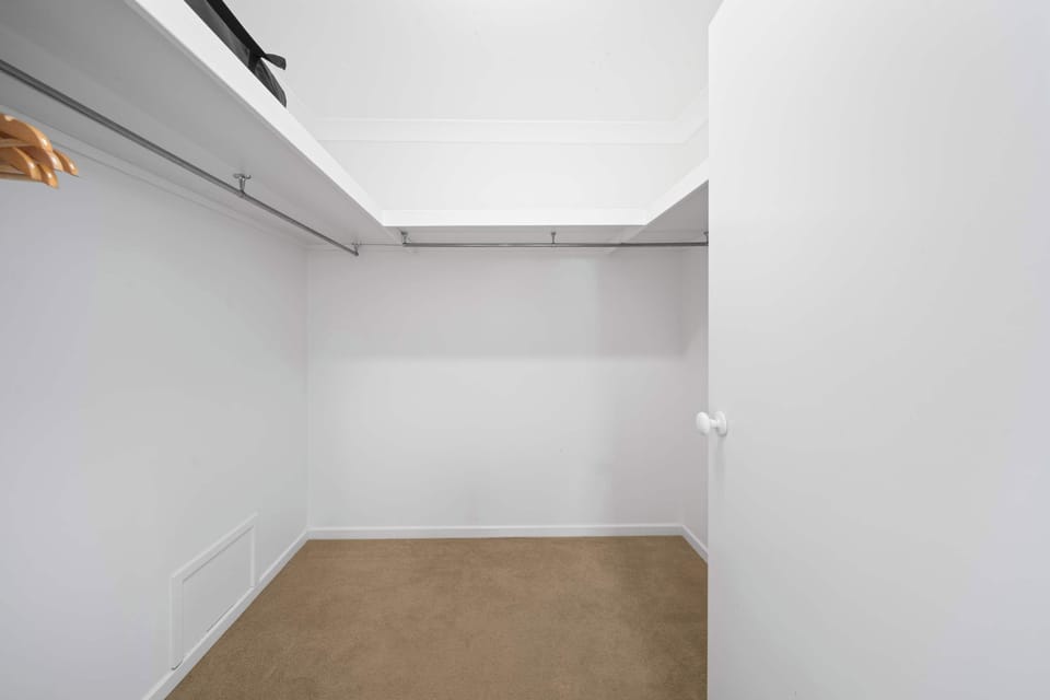 The walk-in-wardrobe is spacious.