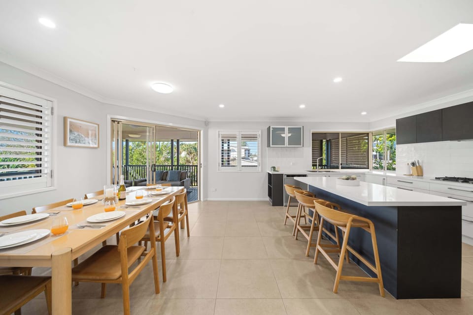 Cook, laugh, and share meals in the modern kitchen and dining space that seats 8 comfortably.