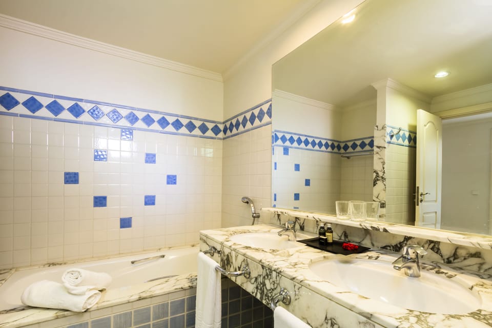 Separate tub and shower, hair dryer, towels