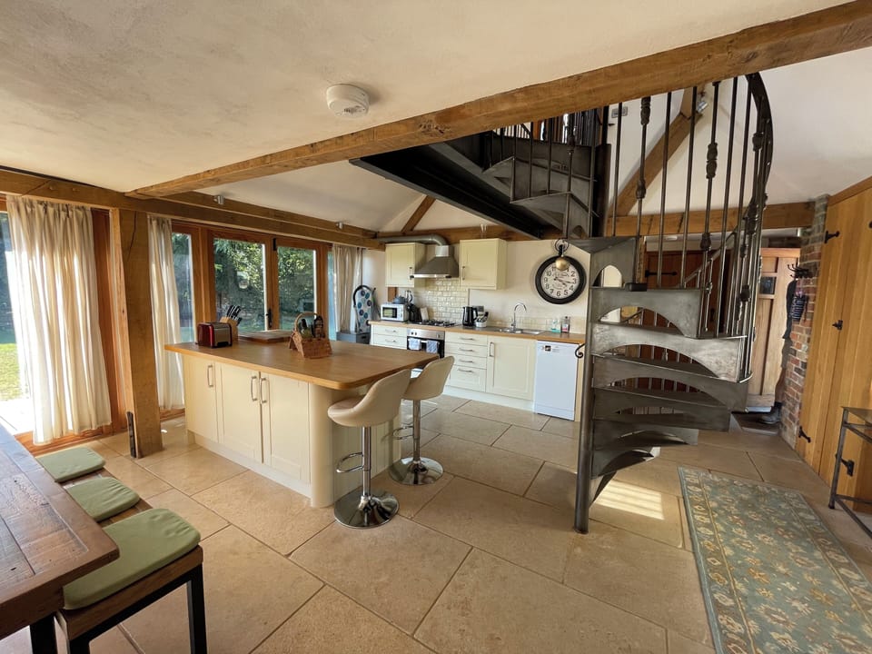 Kitchen area and island with breakfast bar