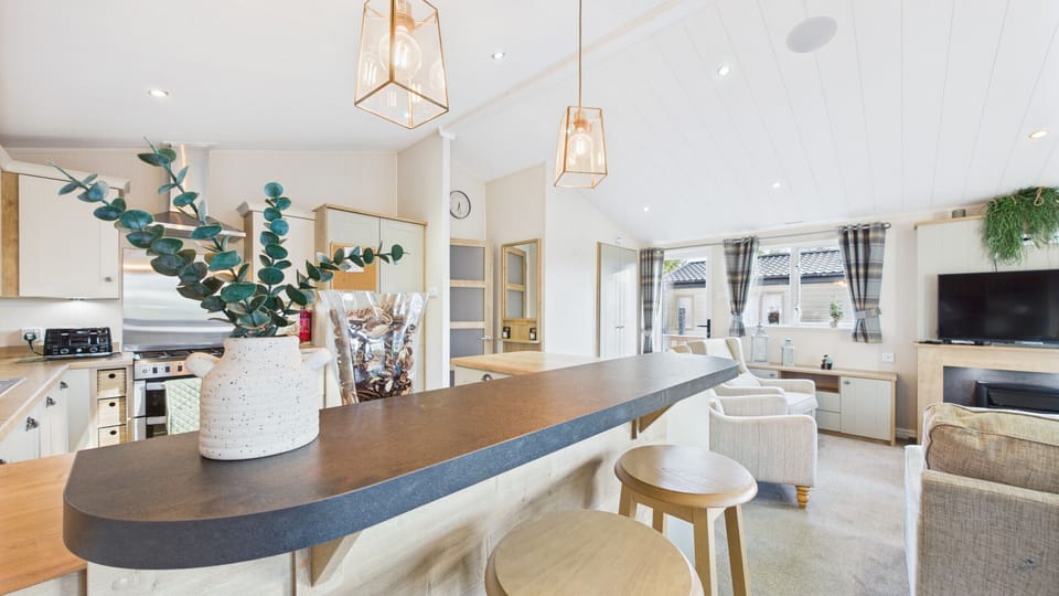 Open-plan kitchen with breakfast bar.