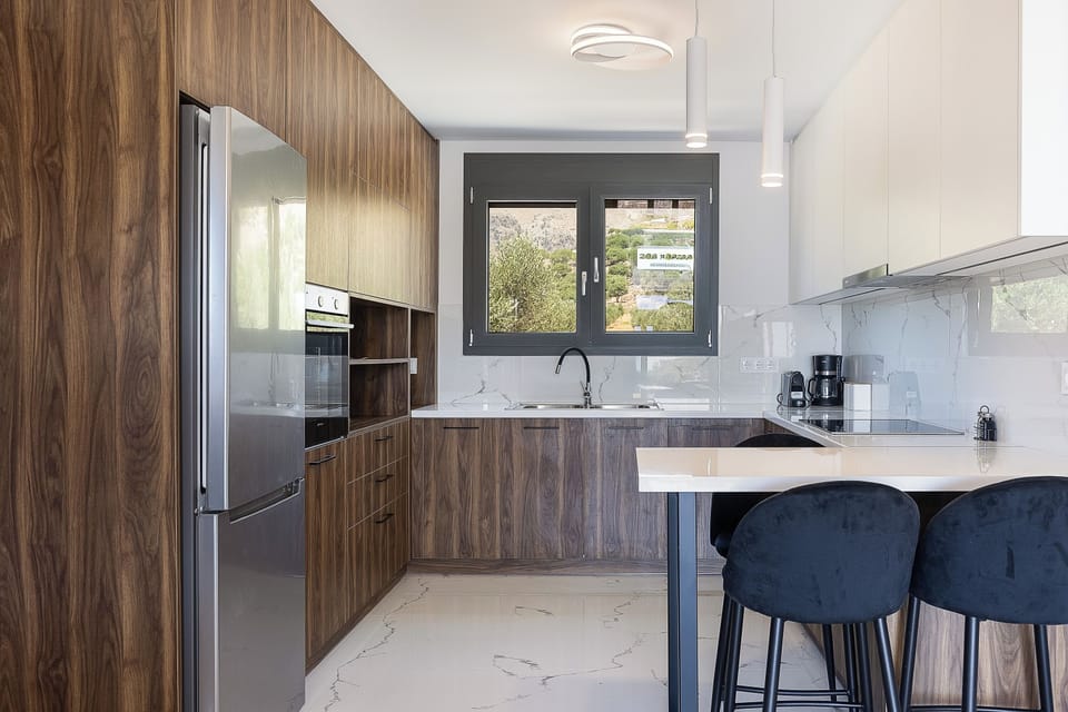 Elegant simplicity meets comfort in this thoughtfully designed kitchen.