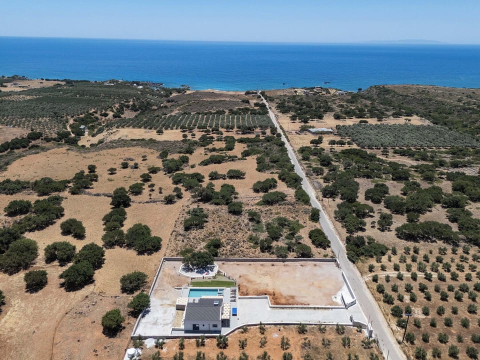A premium villa retreat just steps from the Cretan coastline's embrace.