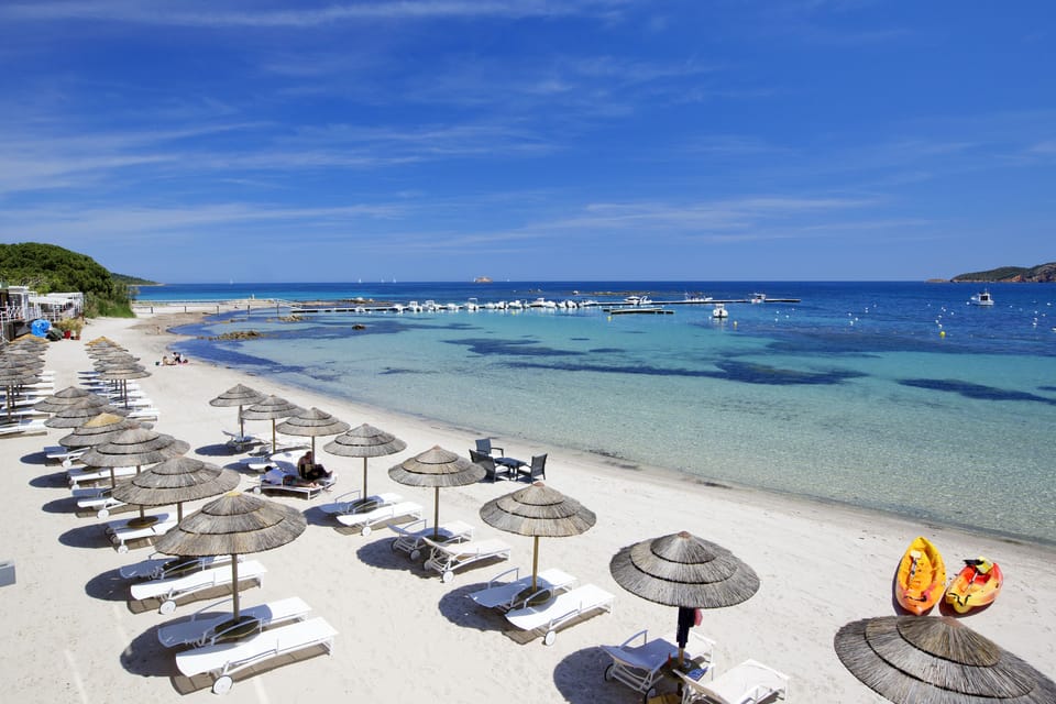 Private beach, white sand, sun loungers, beach umbrellas
