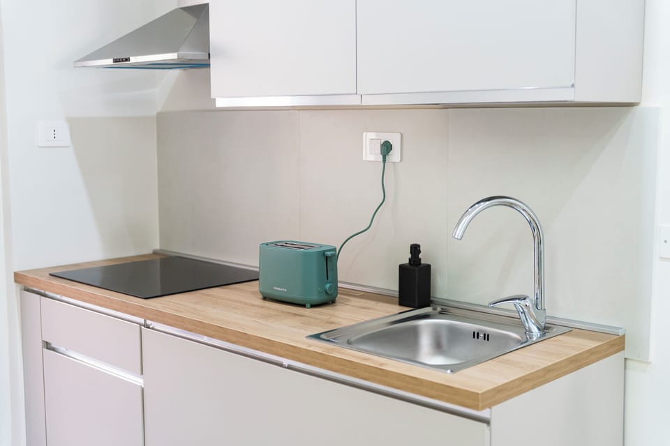 Fridge, stovetop, espresso maker, coffee/tea maker