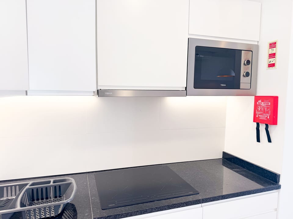 Apartment, 1 Bedroom, Balcony | Private kitchenette | Fridge, microwave, oven, stovetop