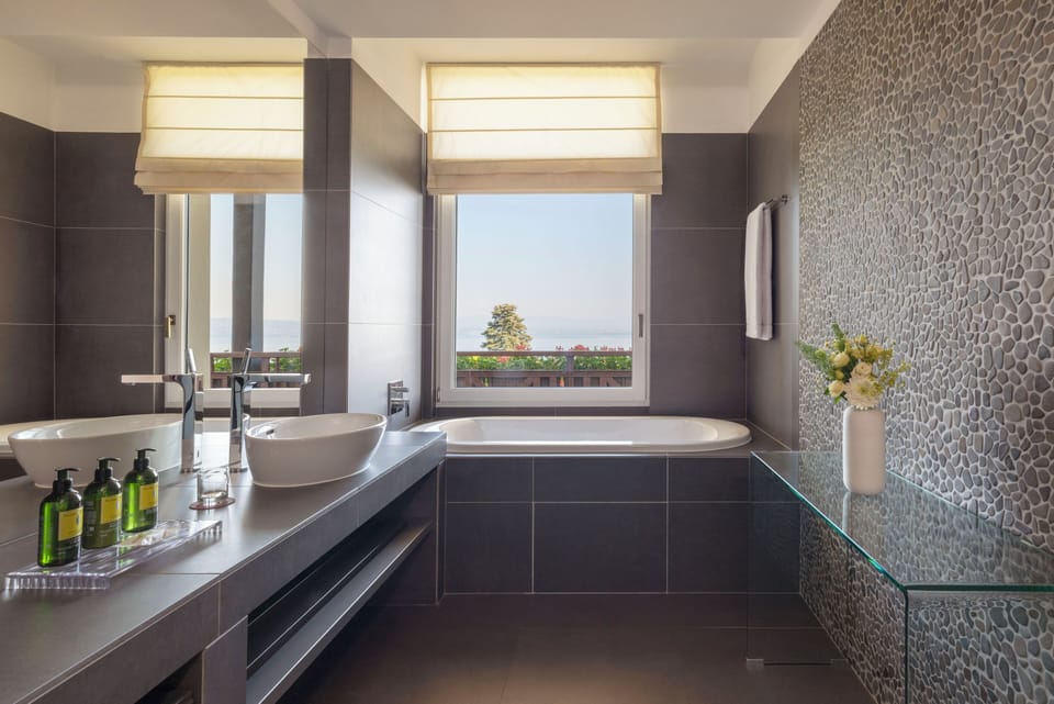 Suite, Lake View | Bathroom | Combined shower/tub, designer toiletries, hair dryer, bathrobes