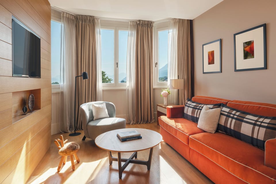 Suite, Lake View | Living area | Flat-screen TV, pay movies