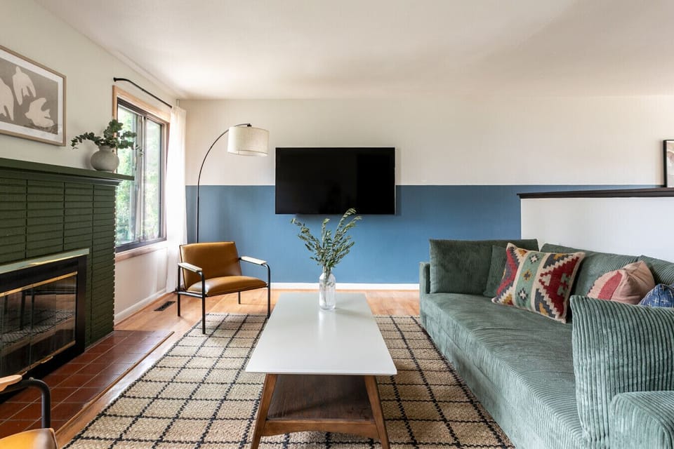 Bright and welcoming space with cozy seating and a Roku TV. Perfect for relaxing or streaming your favorite shows.