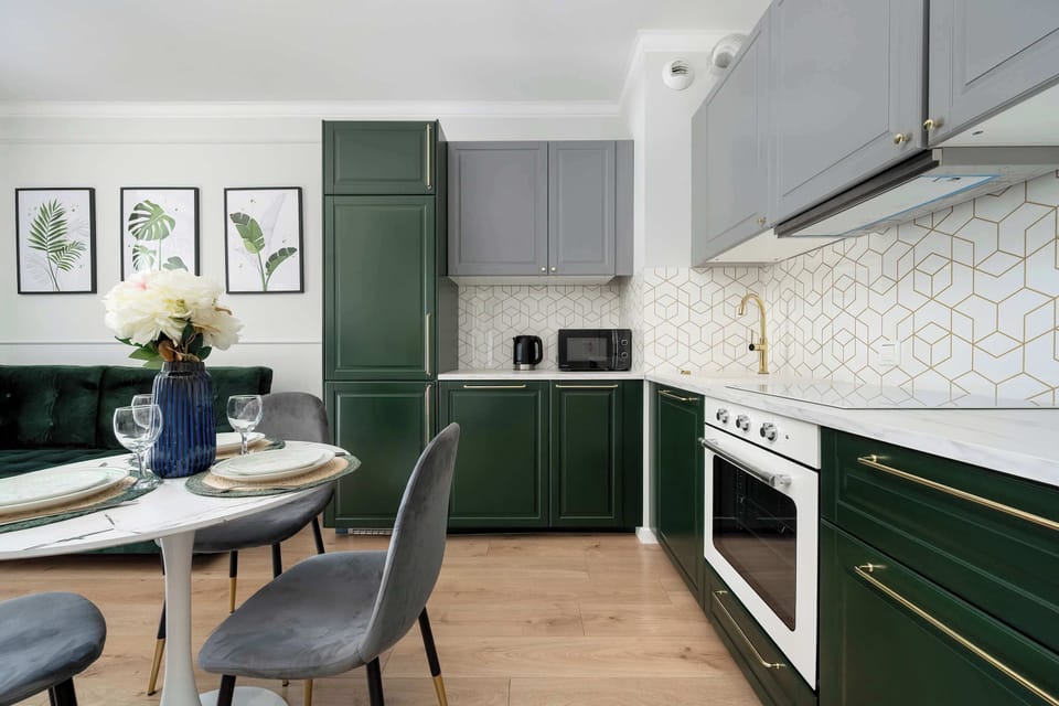 The sleek design of the kitchenette blending seamlessly with the living area.