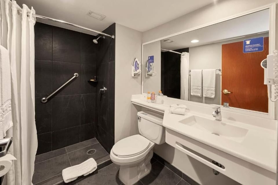 Refresh effortlessly in a clean, accessible walk-in shower bathroom.