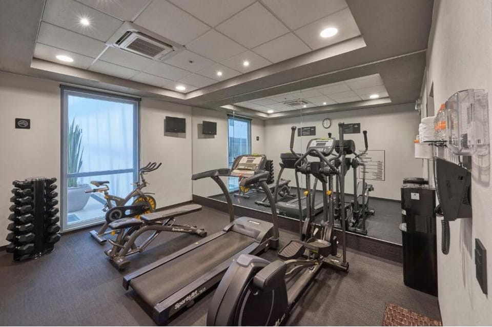Recharge your energy with a bright gym and modern cardio.