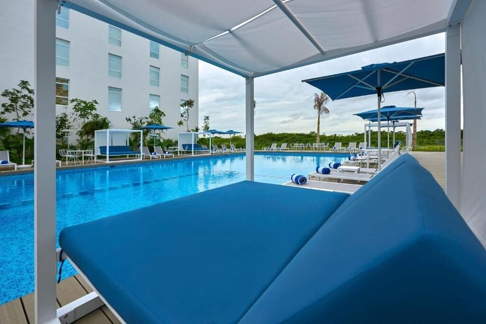 Lounge in a shaded cabana and savor breezy poolside calm.