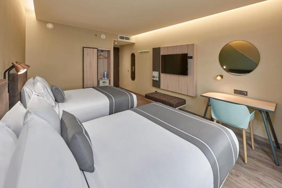 Stretch out on plush beds under soft, ambient lighting.