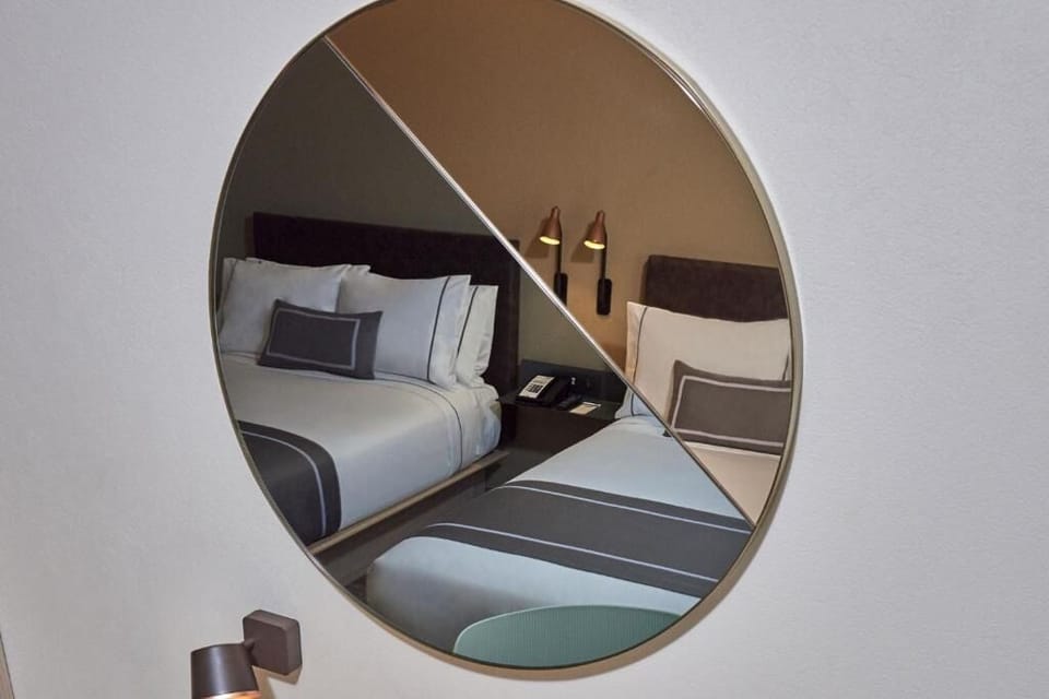 Enjoy cozy evening glow with stylish bedside lighting details.