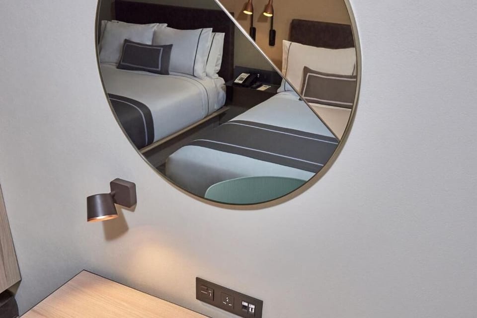 Freshen up your routine at the sleek desk and mirror.