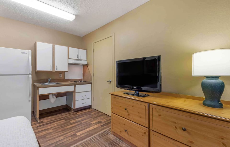 Desk, laptop workspace, blackout drapes, iron/ironing board