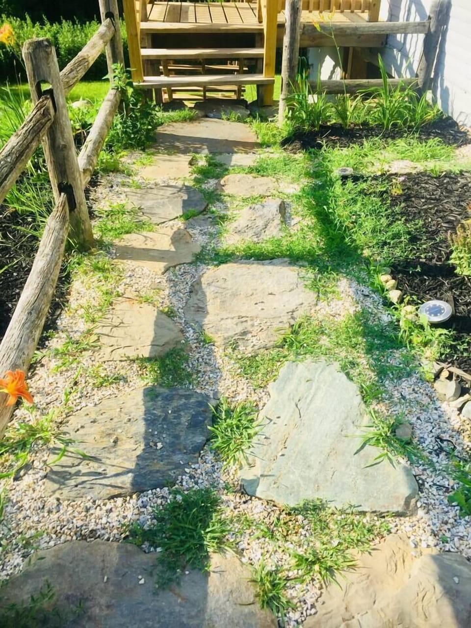 Stone walkway to upstairs unit.
