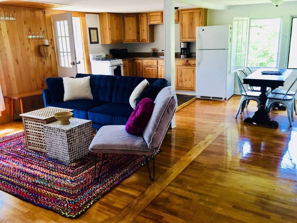 Open living space with lots of light and view of mountain.