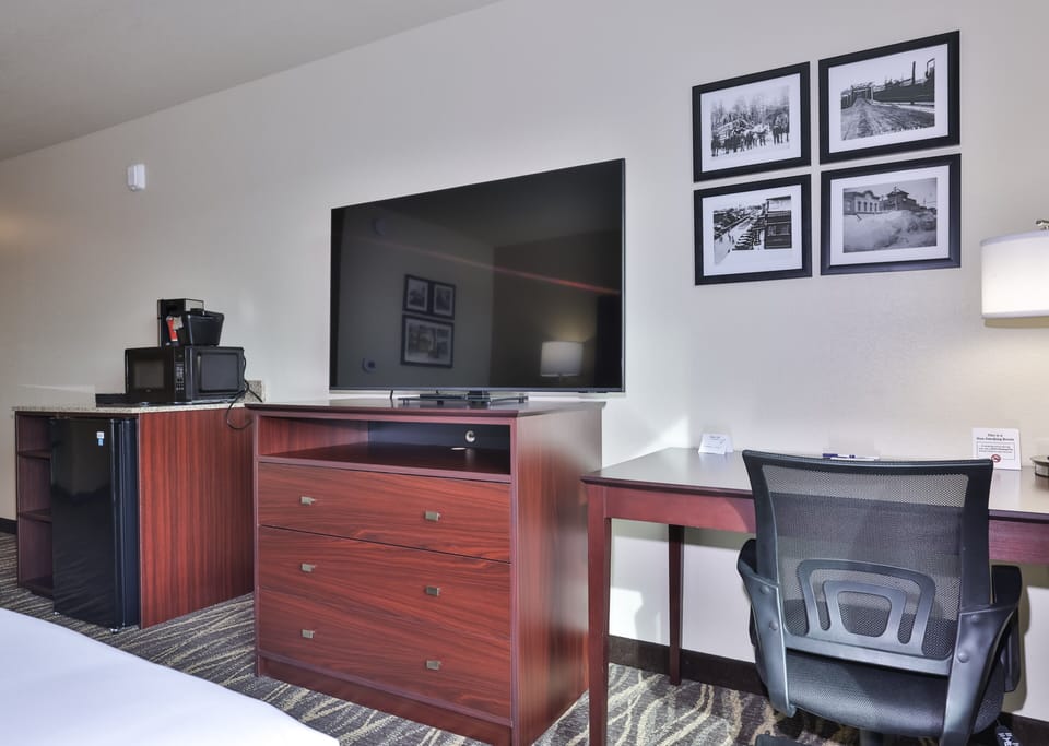 Desk, laptop workspace, blackout drapes, iron/ironing board