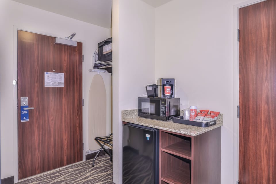 Desk, laptop workspace, blackout drapes, iron/ironing board
