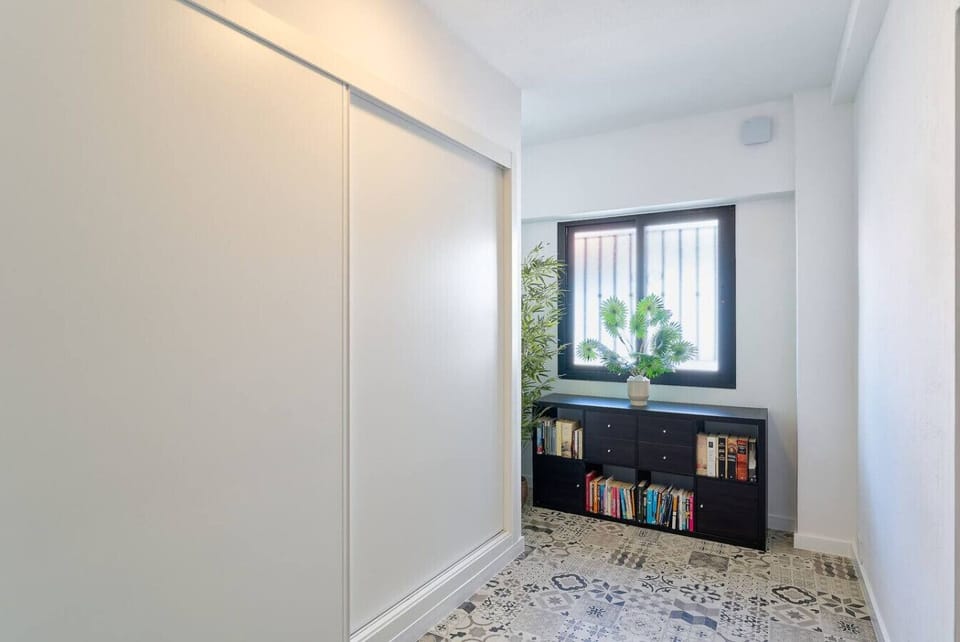 Common area with washer, dryer, and our personal library for you to enjoy some good reading during your stay.