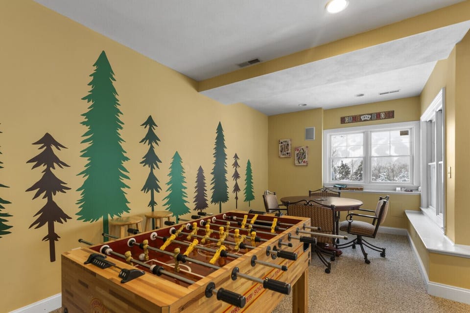 Foosball and poker table in the game room downstairs