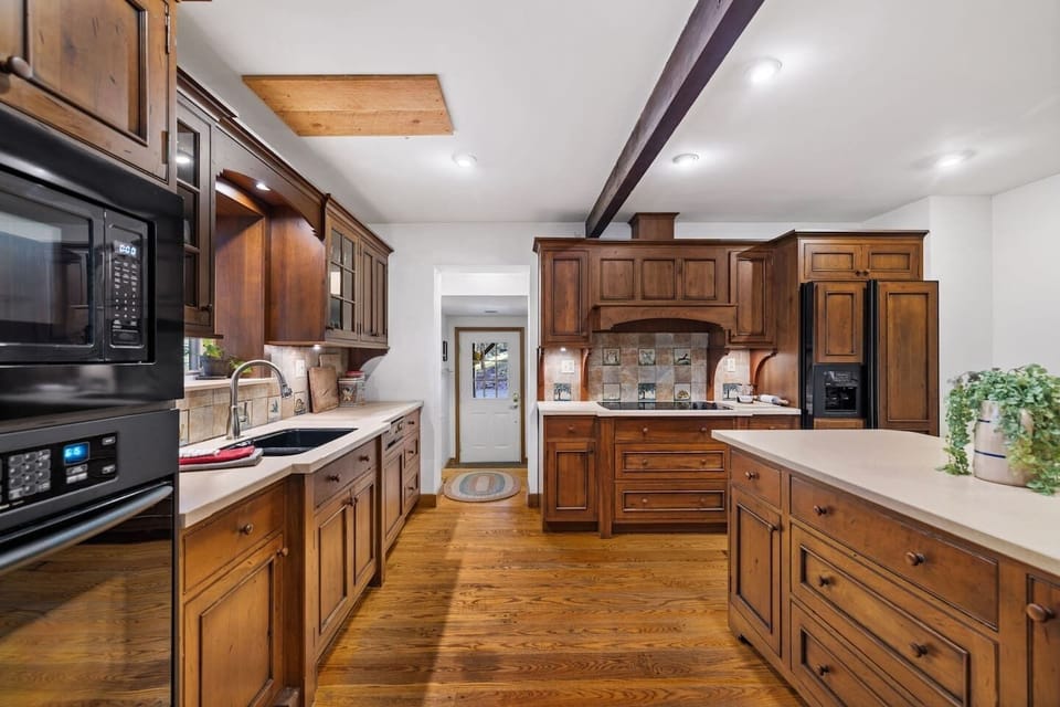 High end, solid wood cabinetry with a soft, glowing patina.
